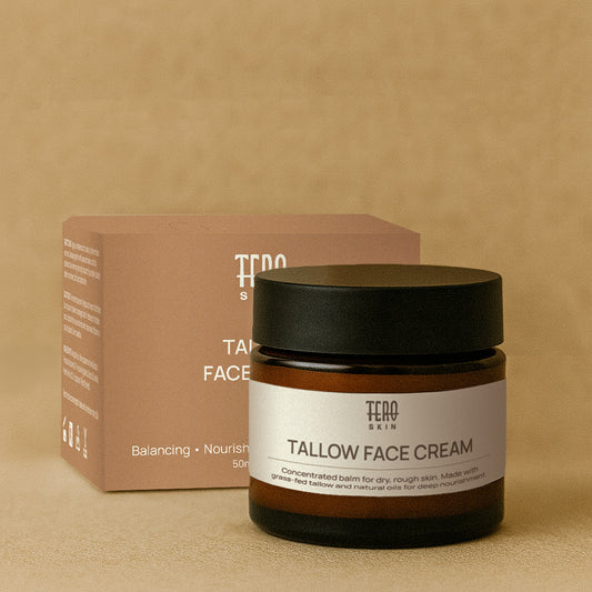 Tallow Face Cream jar with black lid and brown packaging on a beige background